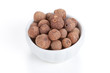 Pile Allspice  in white bowl on white background