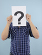Foto: Young man with question mark Young man with question mark