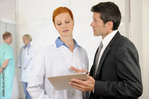 Photo: Administrator talking with Doctor at the Hospital Administrator talking with Doctor at the Hospital