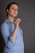 brunette business woman with specs in her hand
