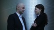 Young businessman and businesswoman flirting
