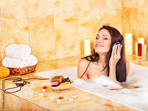 Photo: Woman listening to music. Woman listening to music.