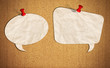 blank speech bubble note paper with push pins on cork board