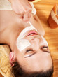Clay facial mask apply by beautician. Clay facial mask apply by beautician.