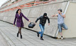 Robbery prevention on the street. Thief tried to steal a bag.