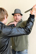 canvas print picture - Burglar is trying to kill man by knife.