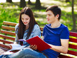 Group student with notebook outdoor.