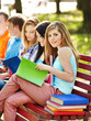 Group student with notebook outdoor.