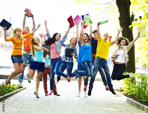 Photo: Group student with notebook outdoor. Group student with notebook outdoor.