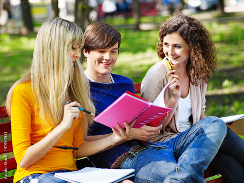 Photo: Group student with notebook outdoor. Group student with notebook outdoor.