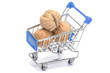 Walnuts in shopping cart on white Walnuts in shopping cart on white