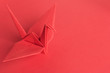Red Paper Crane on a red background