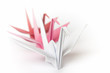 Three queueing paper birds on a white background