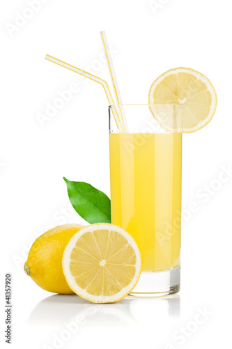 Photo: Lemon juice glass and fresh lemons Lemon juice glass and fresh lemons