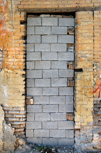 Photo: bricked up door and chipped brick wall texture bricked up door and chipped brick wall texture