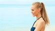 Close up of young beautiful woman on the tropical beach