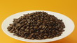 coffee beans on a white plate