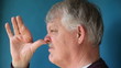 man thumbing nose