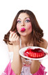 Pretty woman eating pudding. Isolated on the white background