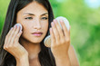 woman with bare shoulders causes powder to face