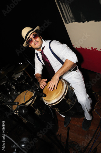 Photo: Cuban percussionist isolated on black Cuban percussionist isolated on black