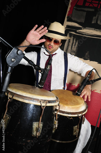 Photo: Cuban percussionist isolated on black Cuban percussionist isolated on black