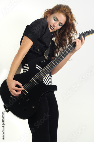 Photo: Funky female playing guitar Funky female playing guitar