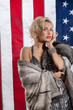 Young Woman In Fur Coat And American Flag