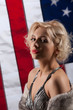 Young Woman In Fur Coat And American Flag