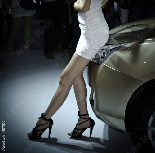 Photo: unidentified model with car unidentified model with car