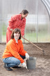 Happy women works at greenhouse Happy women works at greenhouse