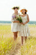 happy women with flowers in summer happy women with flowers in summer