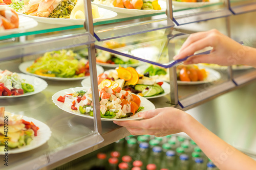 Photo: Buffet self service canteen display fresh salad Buffet self service canteen display fresh salad