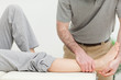 Close up on a doctor examining the foot of a woman