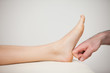 Forefinger touching a barefoot