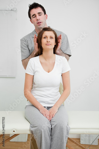 Photo: Woman sitting while being manipulated Woman sitting while being manipulated