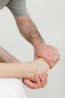 Ball of a foot being held by a physiotherapist