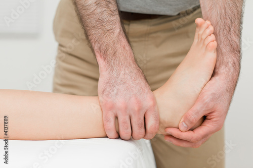 Photo: Ankle of a patient being manipulated Ankle of a patient being manipulated