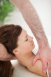canvas print picture - Therapist manipulating the neck of his patient while holding her