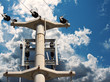 Electricity pylon against a blue sky with clouds Electricity pylon against a blue sky with clouds