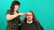 Man having an haircut on the green background, timeLapse Man having an haircut on the green background, timeLapse