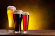Beer barrel with beer glasses on a wooden table.