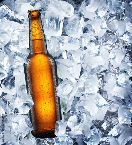 Photo: Bottle of beer is in ice Bottle of beer is in ice