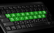 laptop keyboard and text ''Marketing Strategy'' colored green.