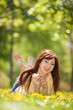 Happy woman with pear in the park Happy woman with pear in the park