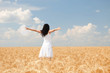 Woman in golden wheat