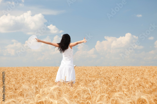 Photo: Woman in golden wheat Woman in golden wheat
