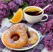 Foto: Sweet donuts and tea with orange Sweet donuts and tea with orange