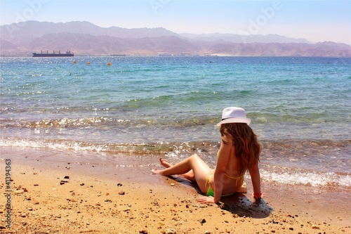 Photo: young girl on the beach young girl on the beach