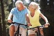 Photo: Senior couple on country bike ride Senior couple on country bike ride